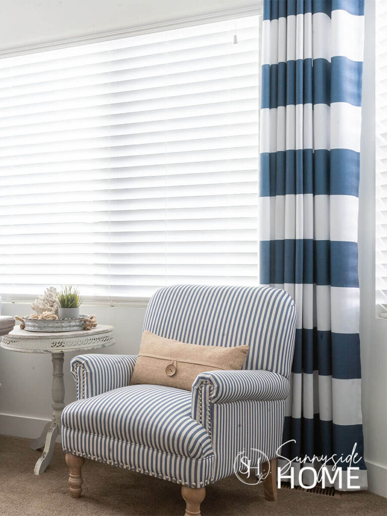Bold blue and white striped curtains and a narrow blue and white stripe chair.