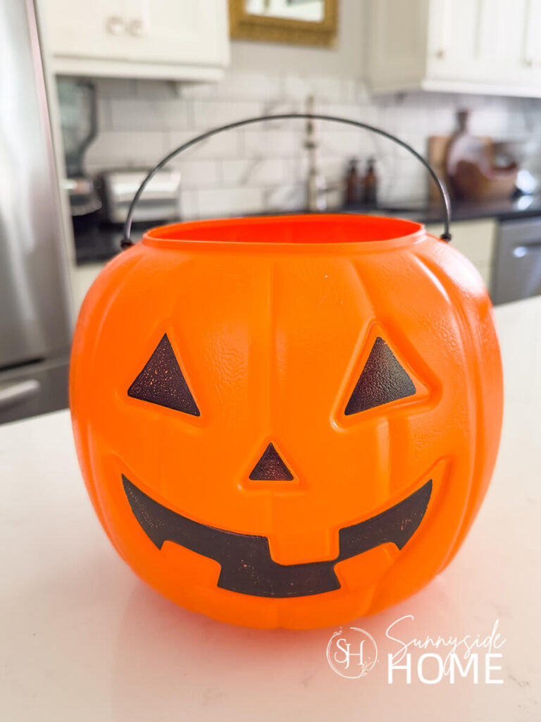 An orange pumpkin bucket.