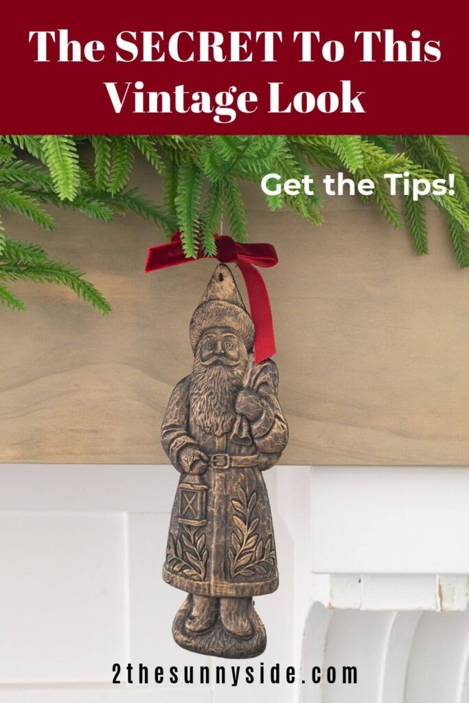 Pinterest image, Vintage inspired brass Santa hung from garland on the mantle. This handmade Santa ornament is cheap to make by looks so expensive!