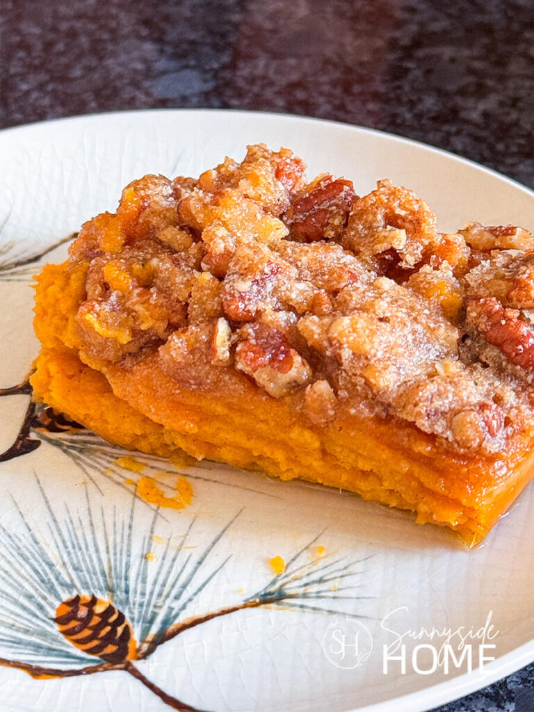 A serving of sweet potato casserole on a plate.